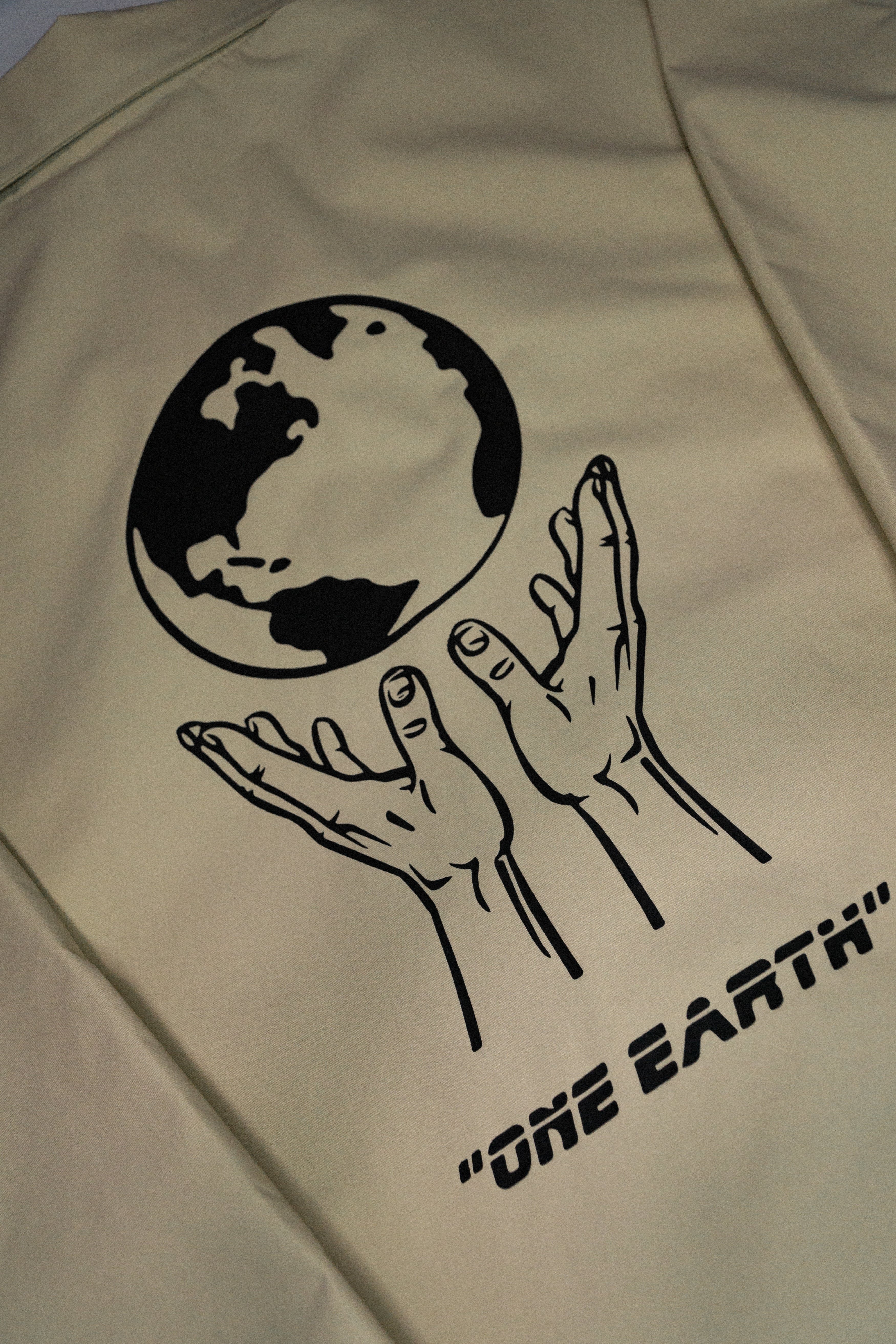 "one earth" coaches jacket